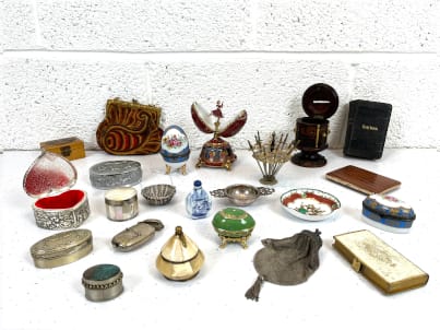 Collection of antique and vintage collectibles including Victorian money box, trinket boxes, purses, gold gilt book and match box