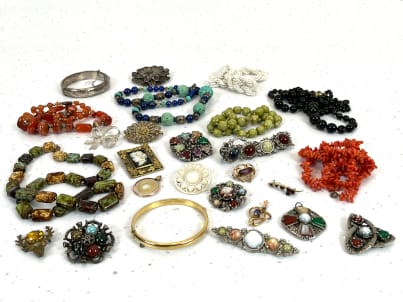 Variety of colourful vintage costume jewellery pieces